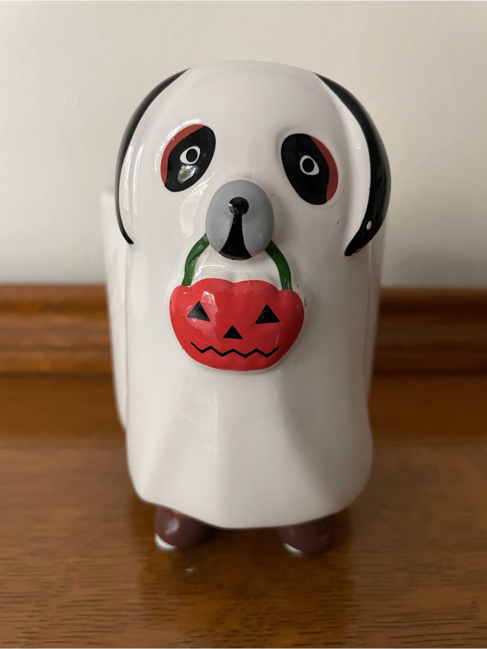 White Dog Halloween Treat Dispenser with Orange Pumpkin